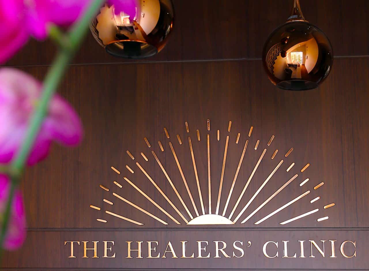 Homepage Hero Healers Clinic Interior Signage Sunburst Logo - healing clinic environment at Healers Clinic Dubai