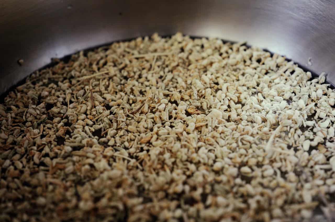 Dried Herbal Medicine Plant Fragments Metal Container Preparation - integrative healthcare treatment at Healers Clinic Dubai