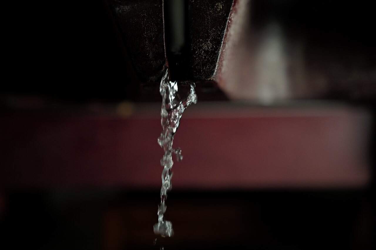 Water Dripping Dark Metal Liquid Flow Closeup Texture - integrative healthcare treatment at Healers Clinic Dubai