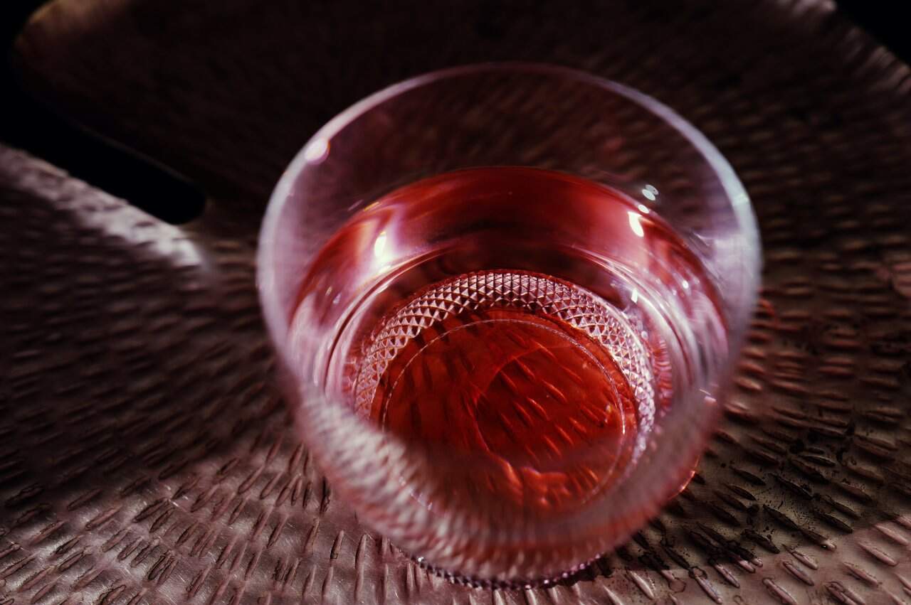 Reddish Pink Herbal Tea Beverage Textured Glass Closeup Room Temperature - integrative healthcare treatment at Healers Clinic Dubai
