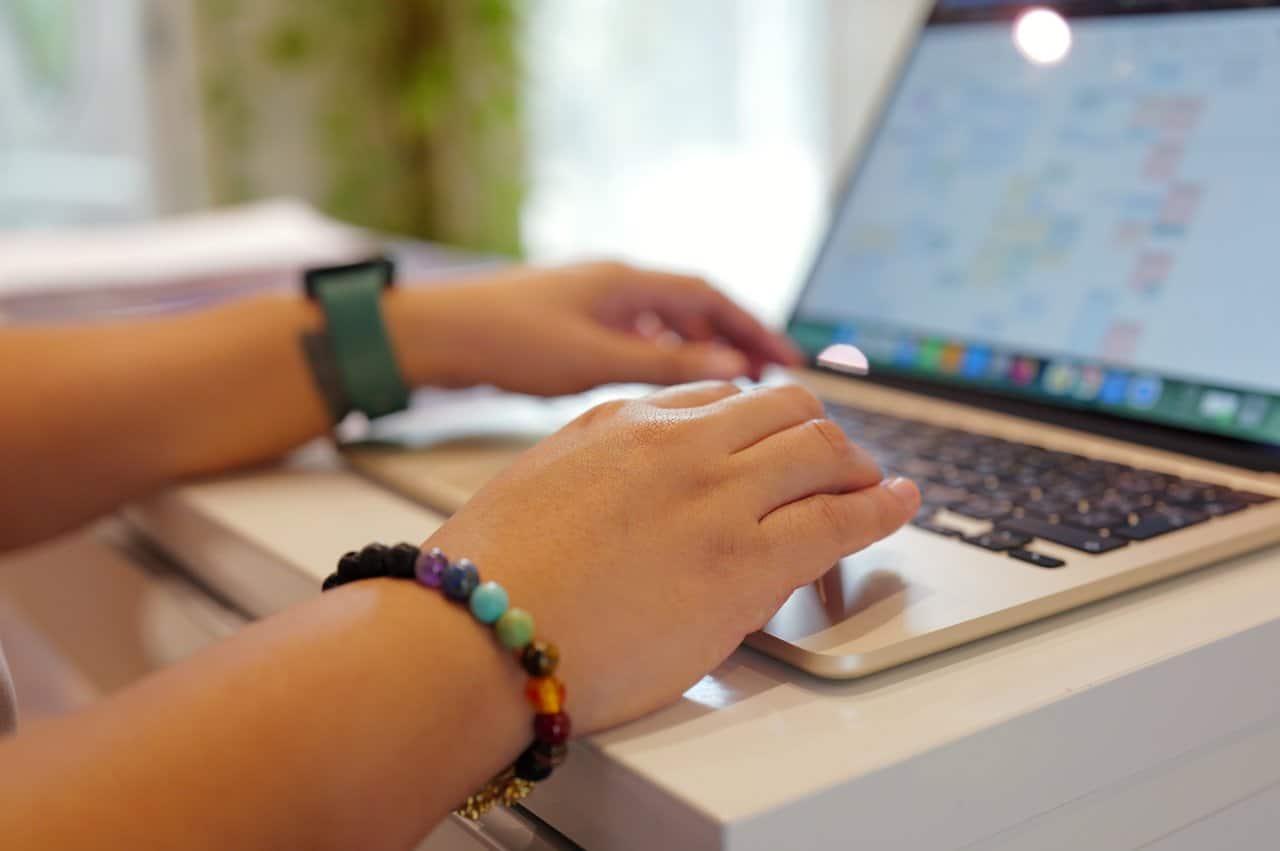 Hands Typing Laptop Keyboard Smartwatch Office Work Productivity - our qualified healthcare team at Healers Clinic Dubai