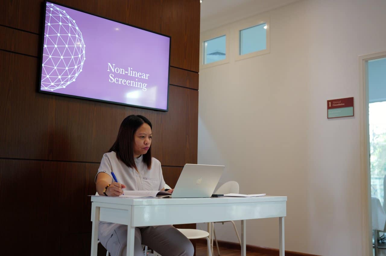 Healthcare Professional Documentation Laptop Paper Notes Clinic Office - our qualified healthcare team at Healers Clinic Dubai