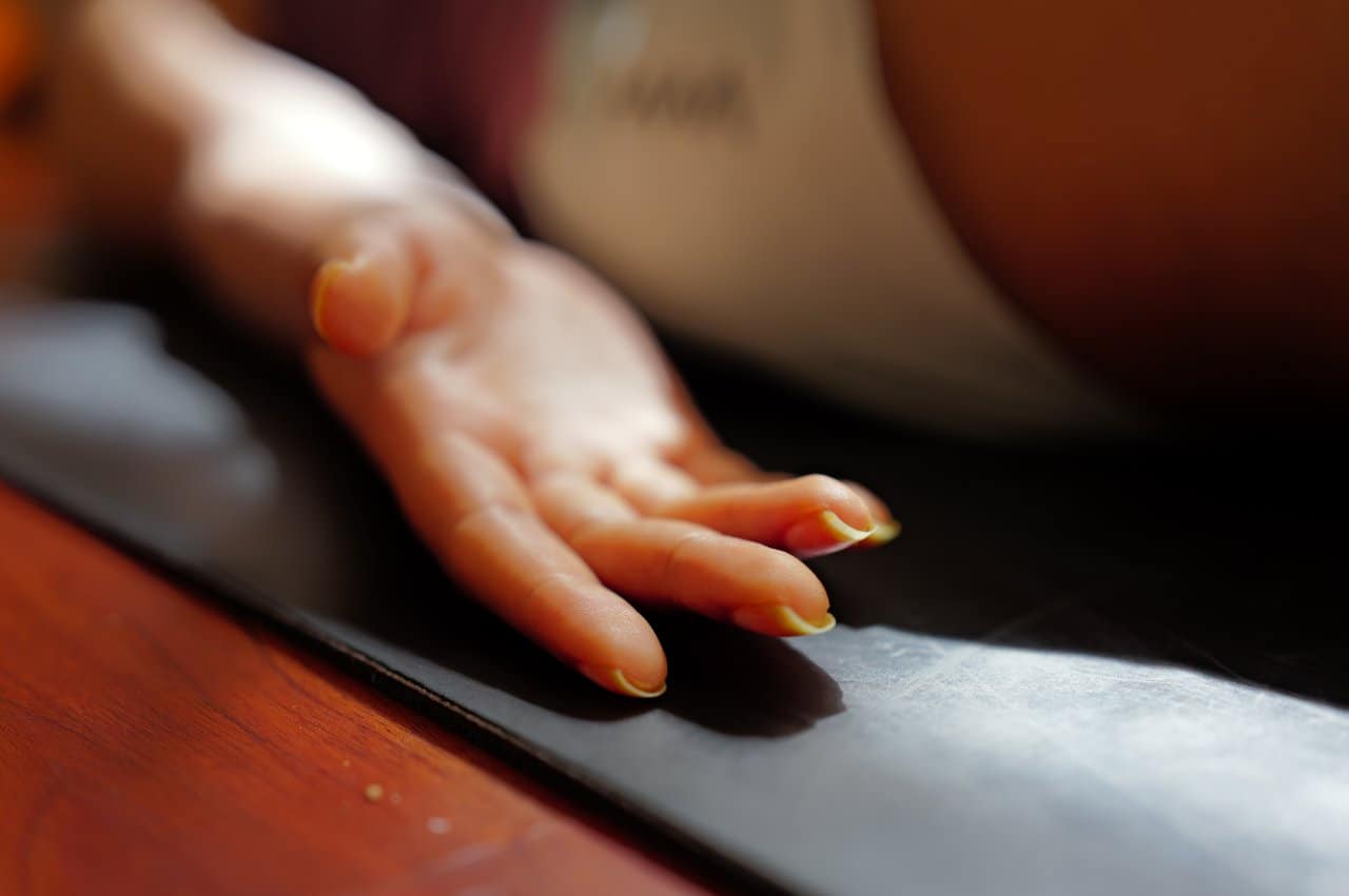 Yoga Savasana Hand Resting Mat Corpse Pose Meditation Peaceful - integrative healthcare treatment at Healers Clinic Dubai